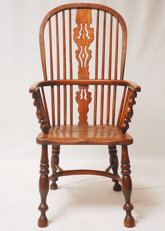 A collection of 8 country English windsor chairs circa 1860. Although the chairs are not an exact matched set, they are very close and look good together.