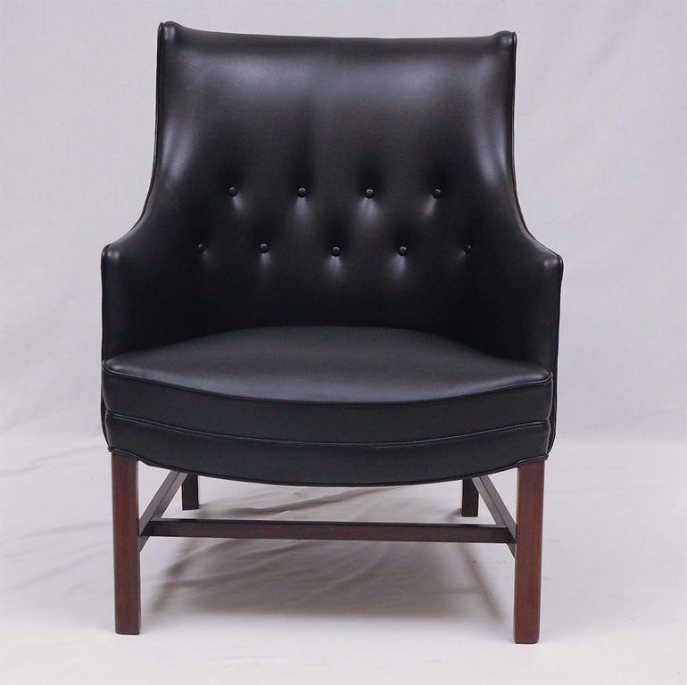 Frits Henningsen arm chair reupholstered in new black leather and beech legs refinished in mahogany.  Store formerly known as ARTFUL DODGER INC