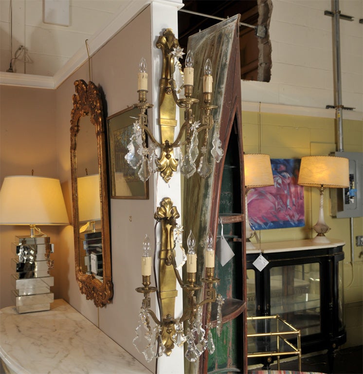Pair of Bronze Sconces with greek key motifs  & crystal prisms