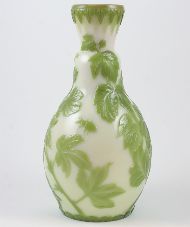 An extremely rare and fine signed Thomas Webb & Sons cameo glass vase, designed by George Woodall in the Oriental style and carved by Lionel and Daniel Pearce with foliage, insects, frog and snake