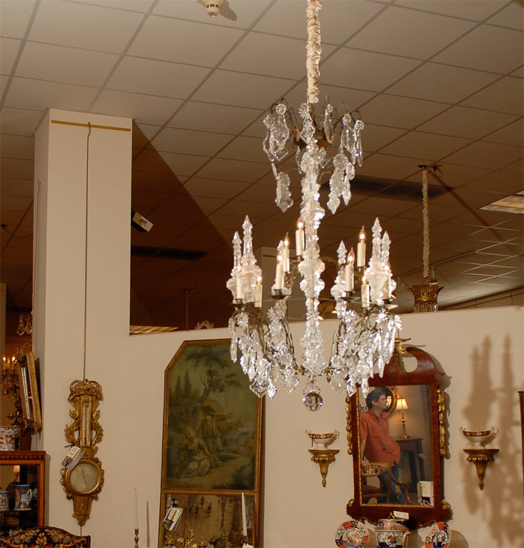 A crystal and brass 10-Light chandelier with blown 