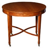 An Edwardian lamp or center table