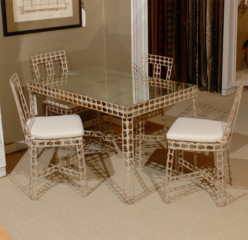Interesting Patio Table and Chairs fabricated from strap metal.  Chairs are very comfortable with new tie-on cushions.  Antiqued mirror top added recently.
