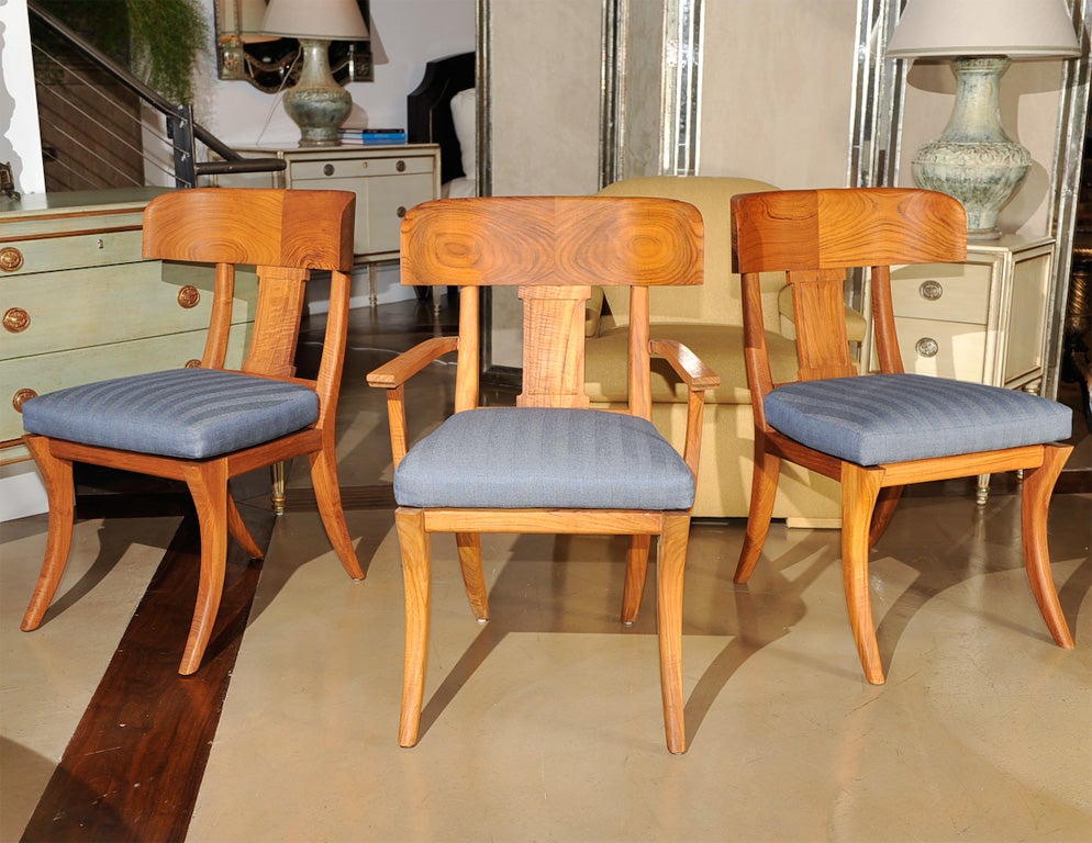 Gorgeous set of 6 Michael Taylor Outdoor Oiled Teak Klismos dining chairs.  Two armchairs and four side chairs each with a reticulated foam seat covered in a navy herringbone outdoor 100% solution dyed acrylic fabric.<br />
<br />
All feet have