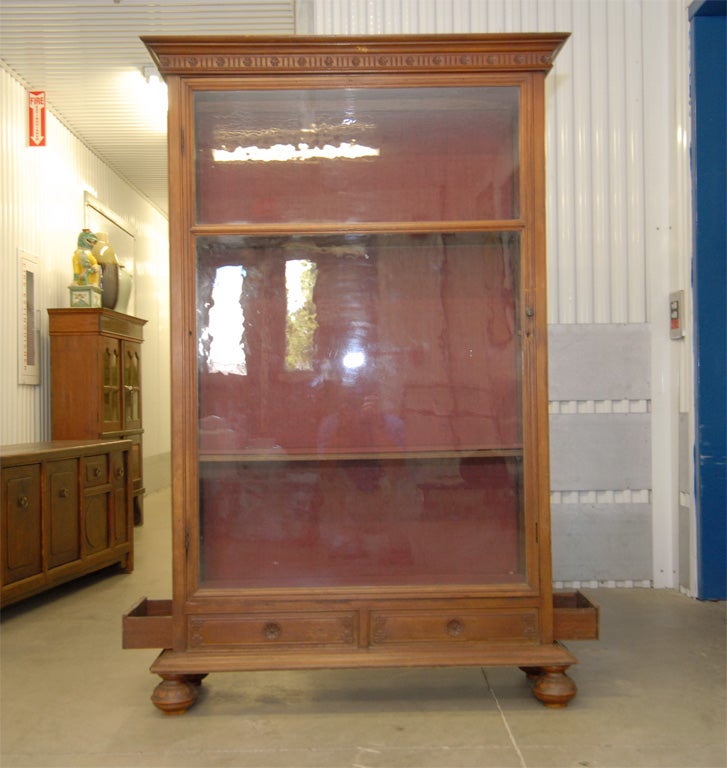 Late 19thC. Indonesian  Dutch Colonial glass front  bookcase, originally gun case, with 2 side doors and lower drawers 