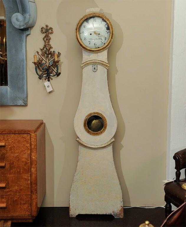 Paint and parcel gilt tall case clock, called a Mora clock in reference to the Swedish city of Mora where these clocks were first designed and built in the 18th century.  This particular clock was built during the second quarter of the 19th century.
