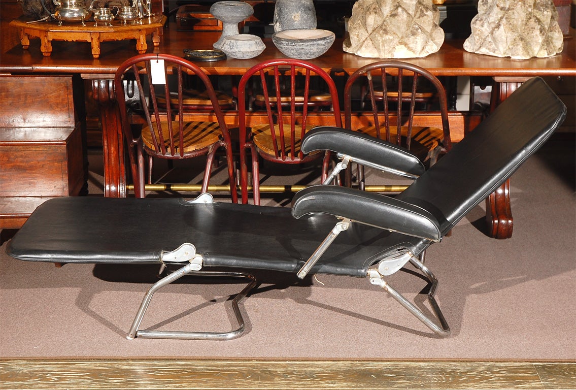 1940s chrome and black leather folding adjustable lounge chair. Cool and industrial, this mid-century piece has an exposed chrome tube framework, a feature emblematic of the period. 

US, circa 1940

Dimensions: 29.5W x D x 77H 
