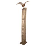 Tall free-standing iron and oak base statue