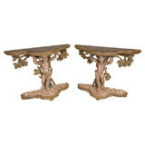 A Pair of Venetian Carved, Painted and Silver Gilt Consoles