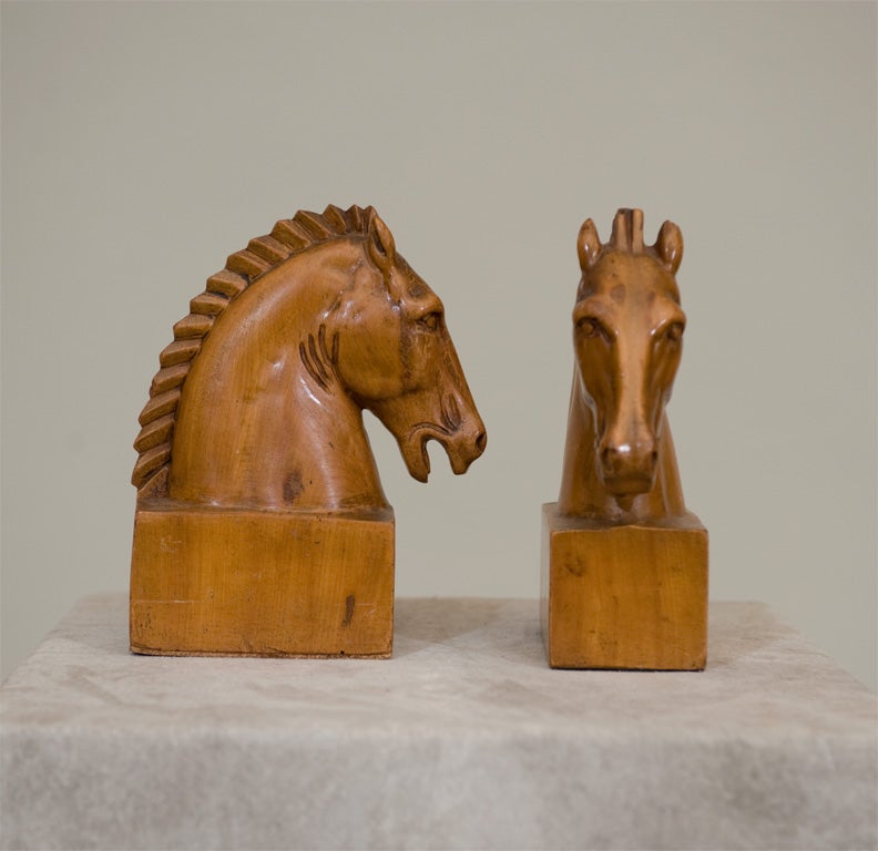 English A Pair of Fruitwood Carved Horse Bookends