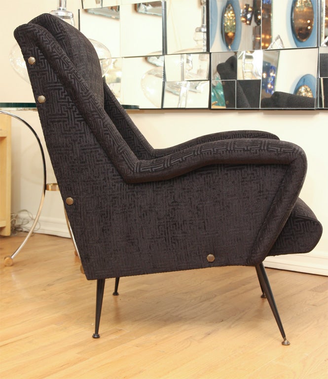 Pair of black upholstered modernist arm chairs