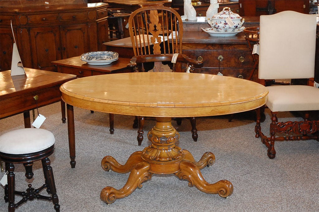 Burr maple oval center table