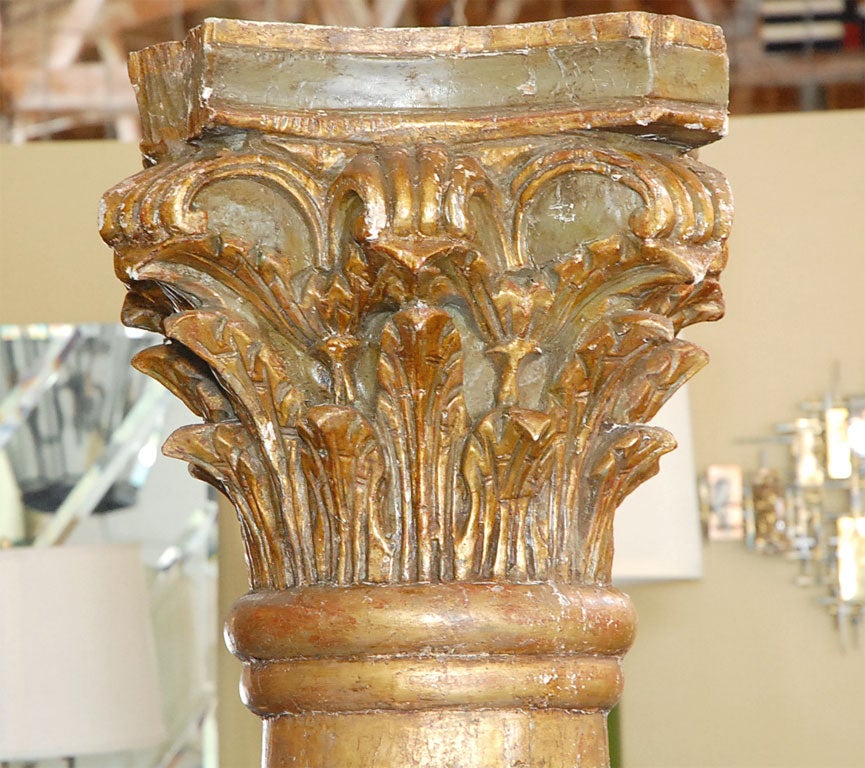 Crowned with Ionic Capitals, these carved fluted columns are unique architectual elements.  Finished in paint and fine parcel gilt, these could be built into the structure of a home or stand alone as grand decor.