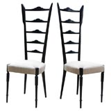 Pair of black lacquered ladder back chairs in the style of Ponti