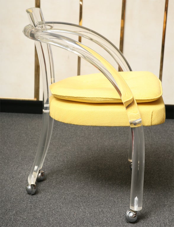 SOLD MAR 2013 Curving thick tubular lucite arms and back highlight these airy armchairs on chrom casters.  With their sunny yellow woven herringbone newly upholstered seats they are ready for the breakfast table or games table.  Very clean lucite