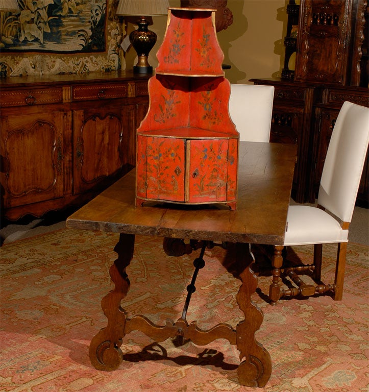 This small cabinet is a little jewel.  It's tomato red color and delicate gold painting in the Choinoiserie style enable it to stand on its own in any room.  It can be hung in a corner, or it stands perfectly well on another piece.  It would be