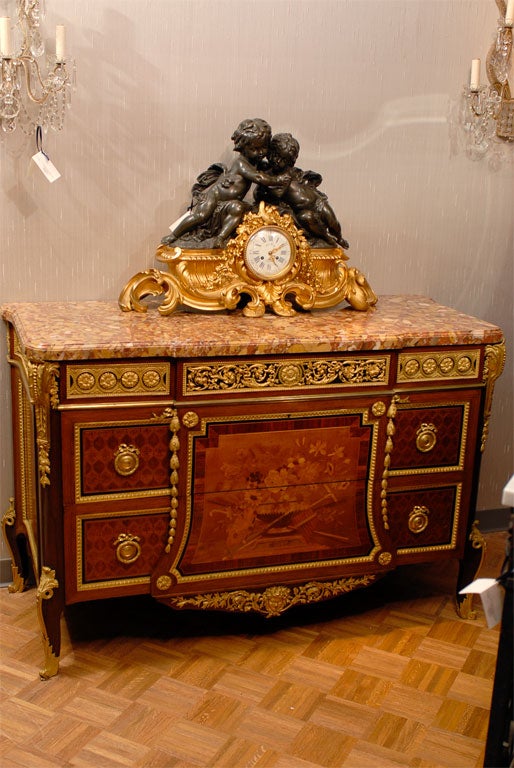 Magnificent and superb quality French clock of gilt and patinated bronze, featuring two cherubs and signed Le Roy, Paris. 