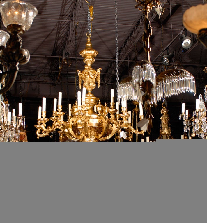 Magnificent hand carved gilt wood chandelier in a Neoclassical style with 16 lights