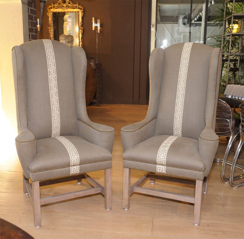 Modern

pair of provincial wing chairs with dramatic high back, sloping arms, and an contemporary stylish look

terminating to contemporary carved and cerused light oak legs

COM: 6 yards per chair

COL: 2 hides, 100’ per chair

lead time: