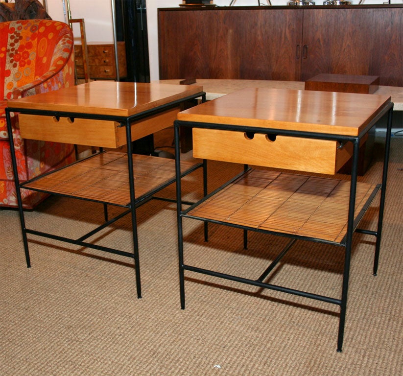 A scarce pair of single drawer 'Planner Group' nightstands with round wrought iron open form frames, solid maple tops and slat bamboo splits lower shelf by Paul McCobb for Winchendon Furniture. U.S.A., circa 1950.