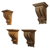 A Set of Four Classical Painted and Parcel Gilt Wall Brackets