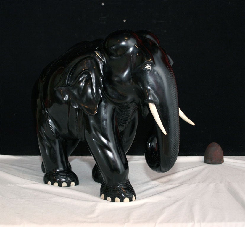 Pair of carved Ceylanese Ebony and Ivory Elephants with articulating ears.