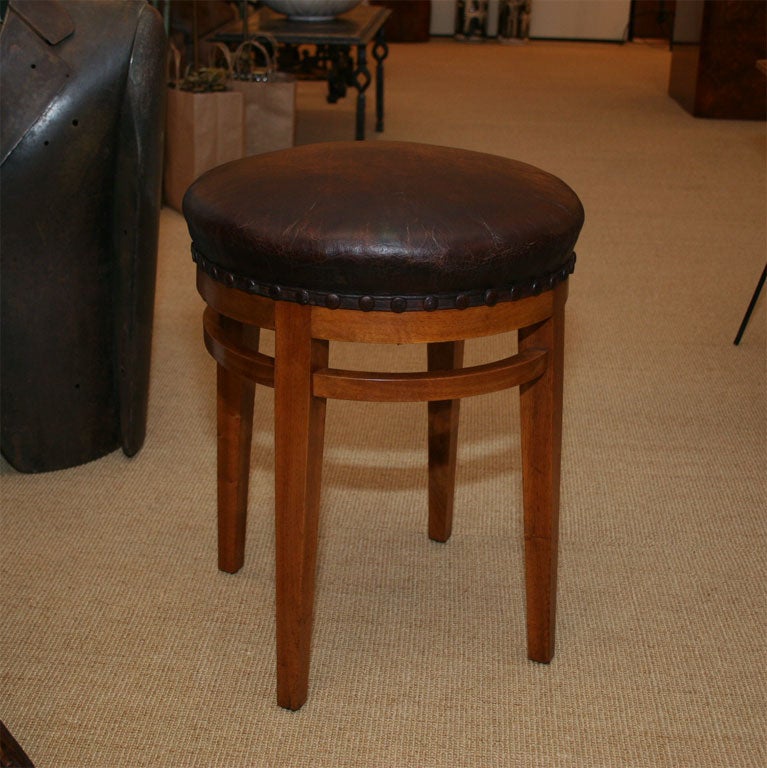 Four-legged leather upholstered stools.
