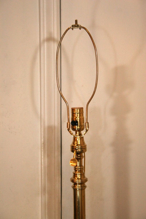 spectacular standing lamp in bronze and wood.The height is adjustable