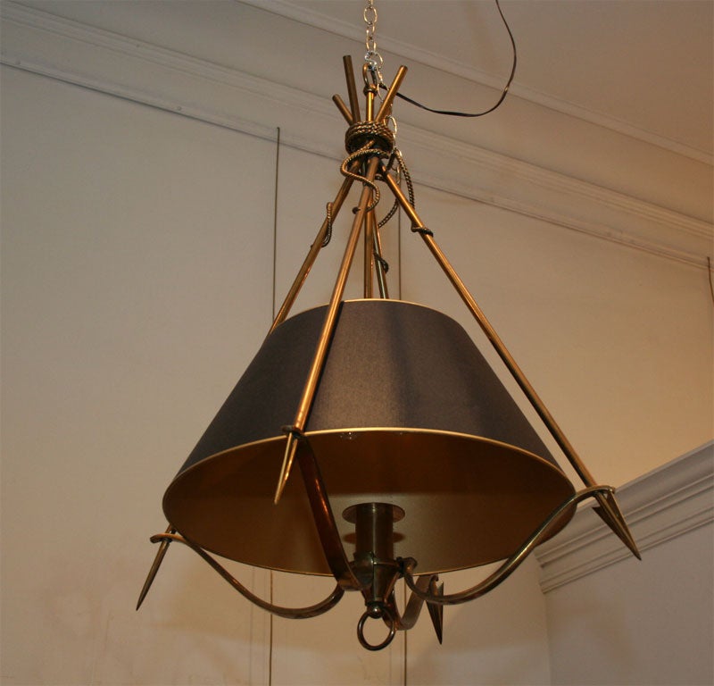 A bronze chandelier in the manner of  Andre Arbus