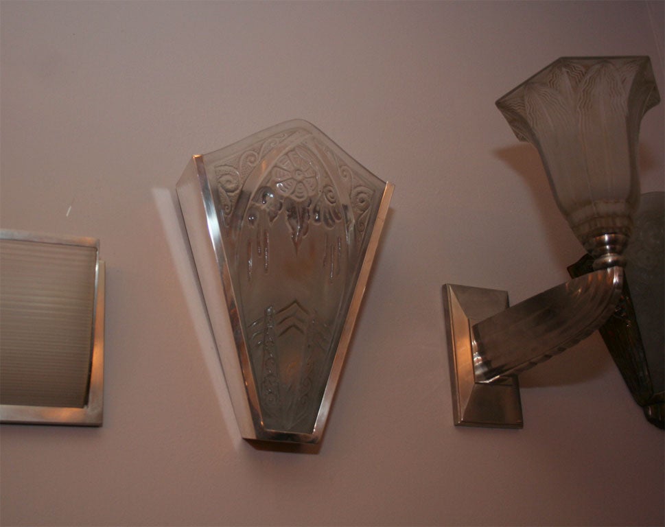 Pair of French Art Deco wall sconces by "Lorrain" (signed, Lorrain is the name used by the Daum company for their pressed glass production).