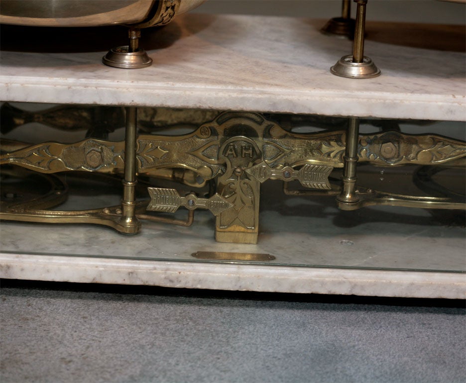 Unusual brass and marble double-pan scale probably originally used  an upscale candy store. Figural footed endcaps, wonderful scrollwork details. The perfect kitchen accessory!