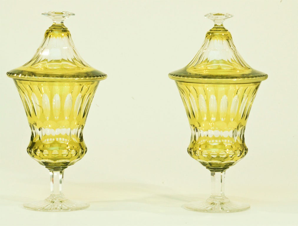 A matched pair of hand blown chartreuse overlay cut to clear crystal covered vases. Perfect for a mantle or sideboard!