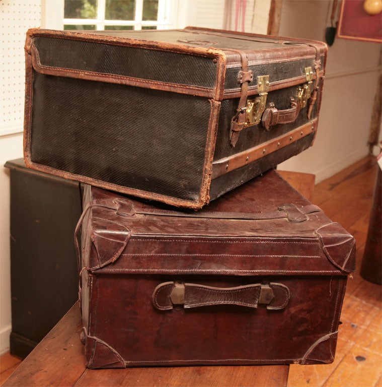 We have two English suitcases. Each are similar in dimensions and together would make a terrific and unique coffee table. There is excellent detail on the black leather suitcase and a very pretty shade of chocolate brown on the other one. All have