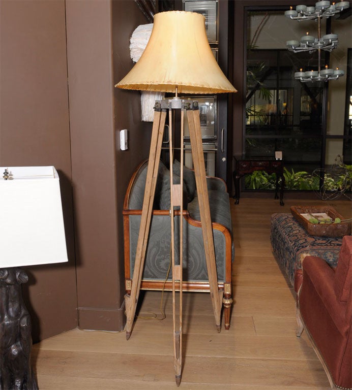tall, adjustable wooden surveyor’s tripod<br />
now electrified into floor lamp