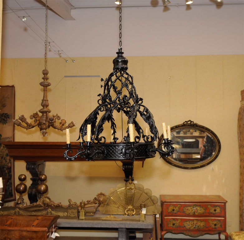 19th century iron eight-arm chandelier. It has been rewired.