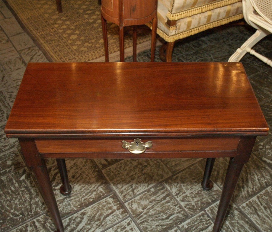 Antique English Georgian mahogany tea table.
