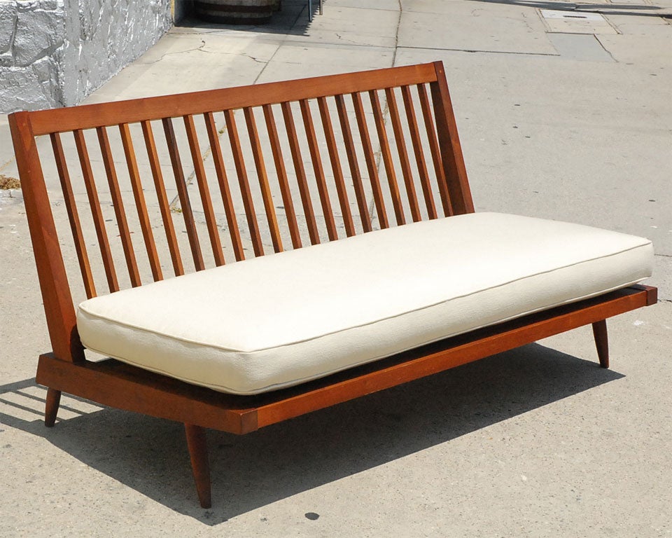A classic Nakashima design, with dynamic lines tempered by traditional and painstaking mortise-and-tenon construction.<br />
<br />
(Though photographed with only the seat cushion, a matching back cushion is included.)