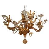 A Stunning Giltwood and Crystal Twelve-Light Chandelier