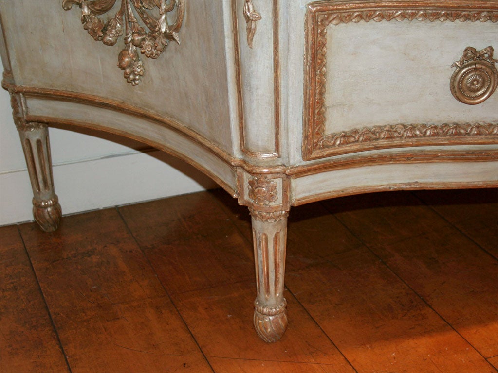 A Venetian Painted and Silver Gilt Two Drawer Commode