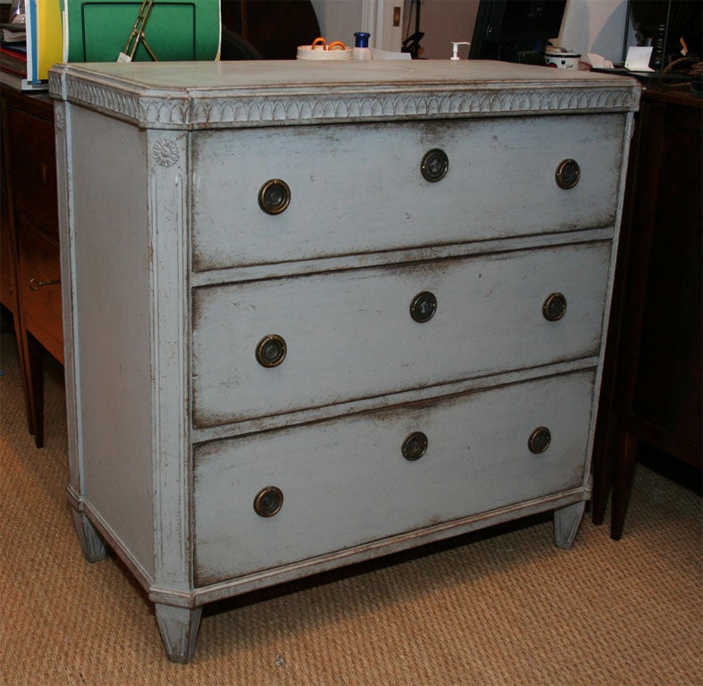 19th Century Gustavian Painted Commode, with decorative egg and dart molding above three drawers, the chamfered sides with carved rosette decoration. <br />
<br />
To see similar pieces in our inventory please visit www.suzannegoldenantiques.com