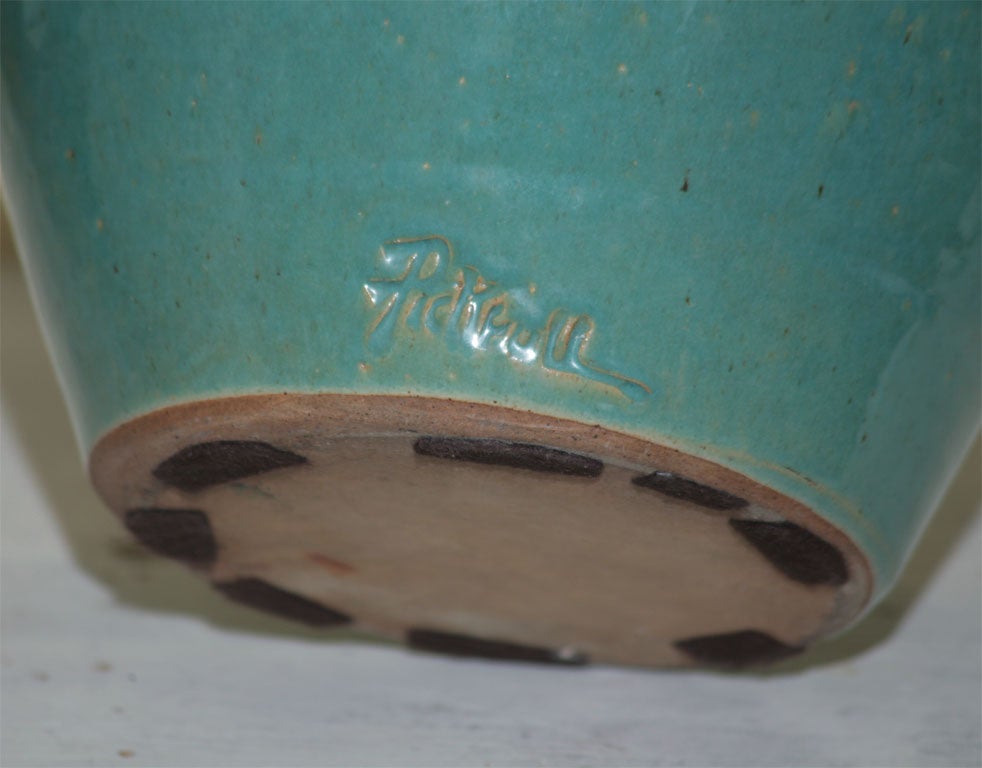 A GREEN GLAZED ENGLISH POTTERY VASE