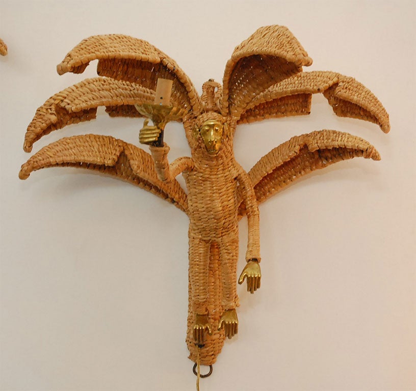 Whimsical  wicker  monkey sconces with beautiful  brass  face, ears,  feet  and hands  holding  candelabra.