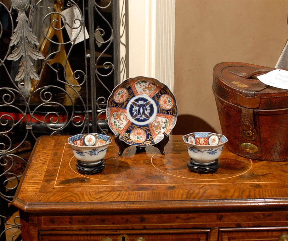19th Century Japanese Imari Porcelain Plate with scalloped edge and cobalt and bittersweet decoration of birds and florals.  <br />
Pair of 19th Century Japanese Imari Porcelain bowls in an octagonal shape with a similar cobalt and bittersweet
