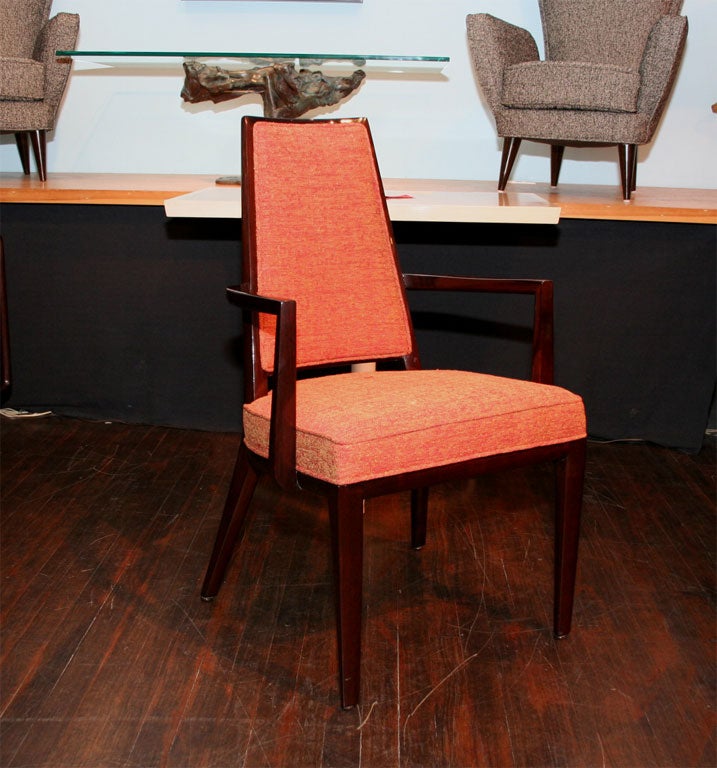 Set of eight high back dining chairs by Monteverdi-Young.  Solid mahogany frames of tapering dowel form. High seat back that narrows towards the top. Six side chairs and two with arms. Only two chairs have been restored at this point. The price