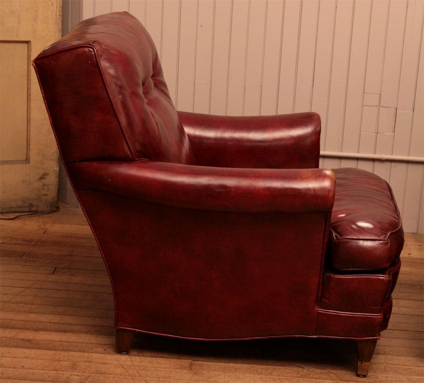 pair red leather club chairs<br />
separate cushions<br />
large and comfortable