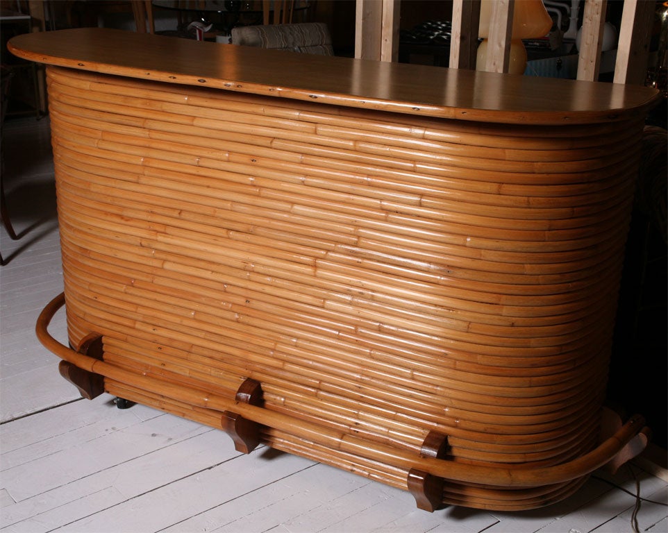 Stacked rattan bar in the style of Paul Frankl.  ***Contact/Shipping Information: AOL (American Online) users may experience difficulties sending emails to us or receiving emails from us. If you have made an inquiry to us and have not received a