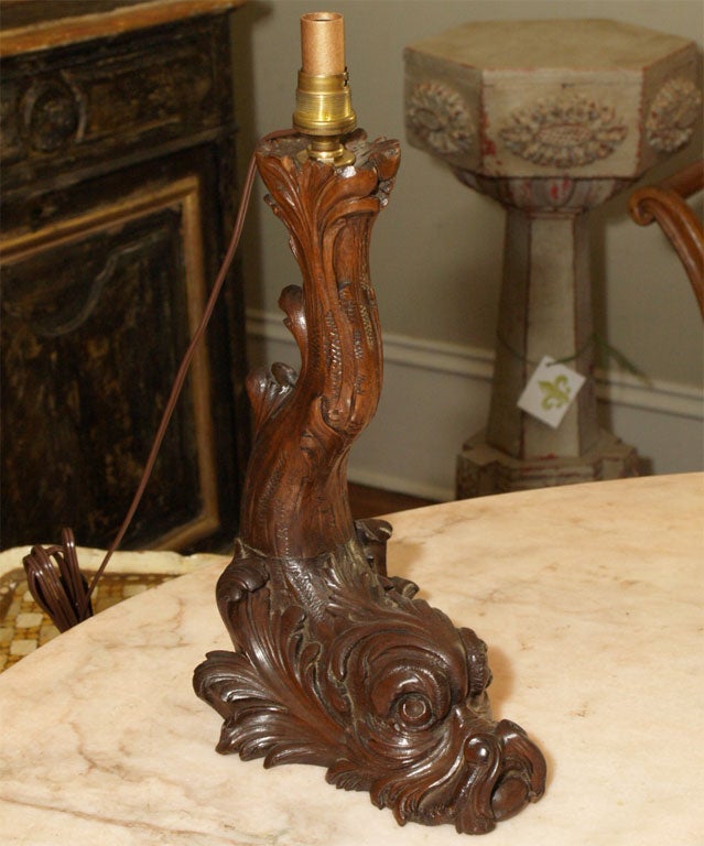 Well carved lamp of heraldic dolphin form, with an upended tale, the expressive, detailed head forming the base.
Shade not included.