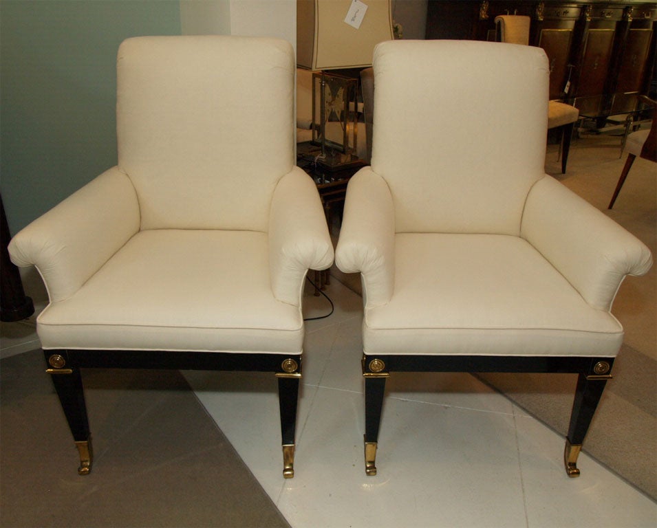 Pair of MasterCraft armchairs now upholstered in icy gray weave; the frame and legs in black lacquer with polished brass detailing.
Note that the photos were taken with only white muslin covering the chairs.