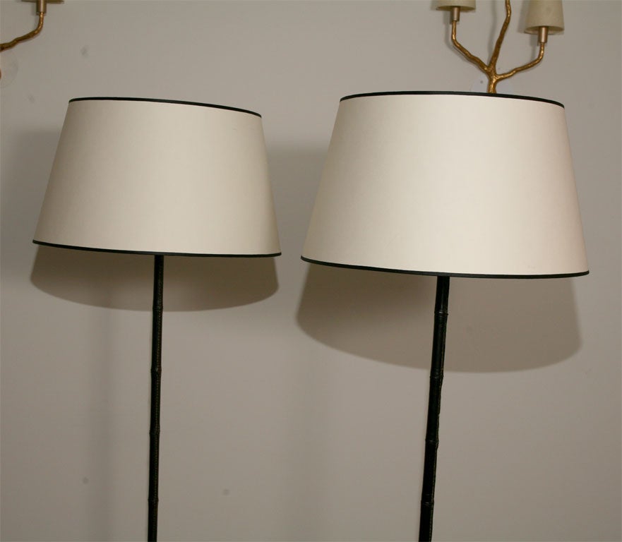French Pair of leather standing lamps by Jacques Adnet