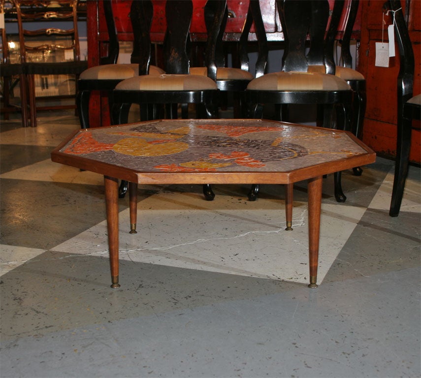 This table should be called a Martini table.  Get out those 50's Martini glasses!  We think that the frame and design are American. The tiles look like they could be Italian.  It is filled with fun and life.  Oranges browns golds and a beigy white